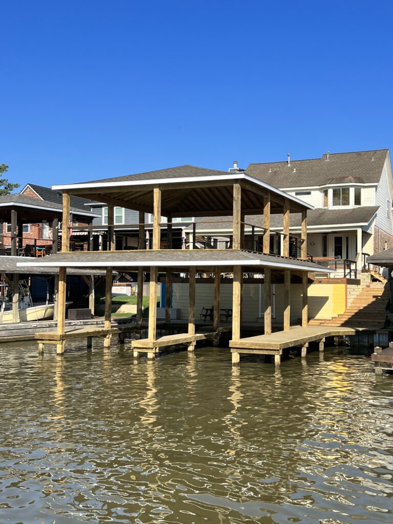 Boat house builder designing a modern dock house