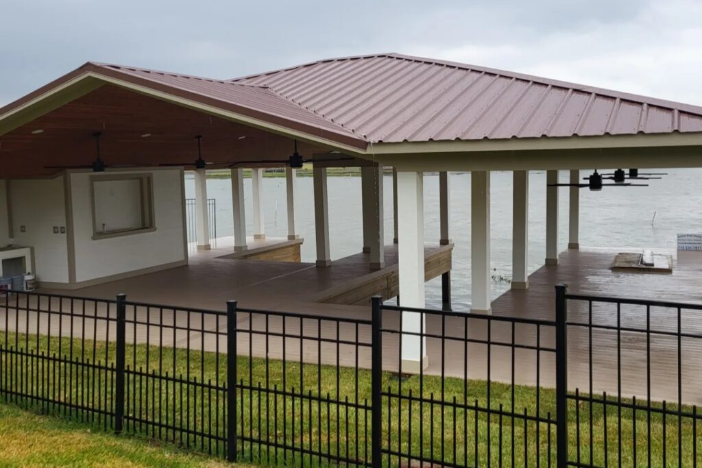 Houston waterfront boathouse and dock under approaching thunderstorm with dark clouds and calm water